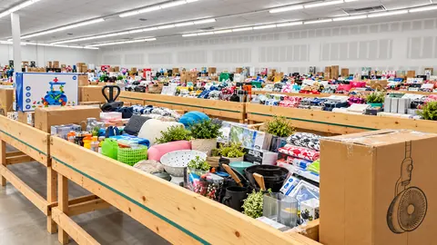 Long rows of wooden bins filled with mixed merchandise