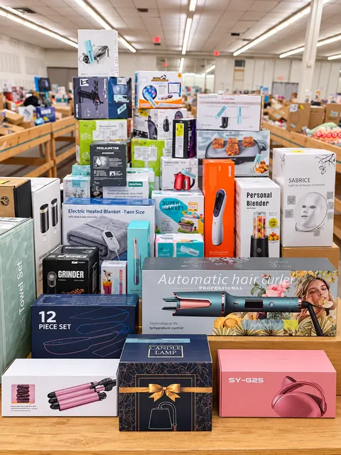 A tall display of boxed beauty tools and small electronics