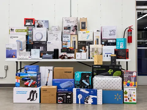 A table stacked with boxed electronics and home gadgets